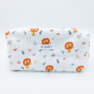trousse blanche sur fond blanc avec des motifs de lions